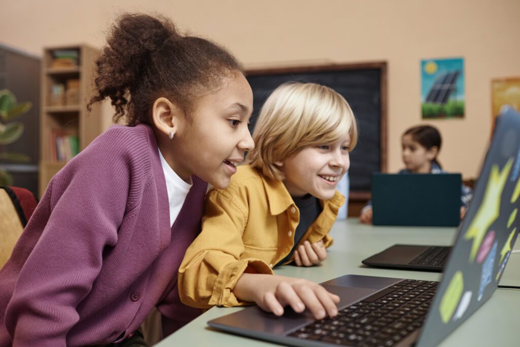 Kids using a computer at school